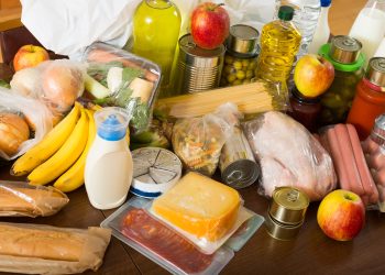 View at table with articles of food for  family  in home